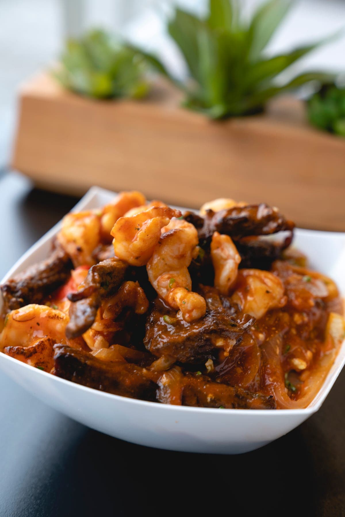 Steak and shrimp in a savory house sauce